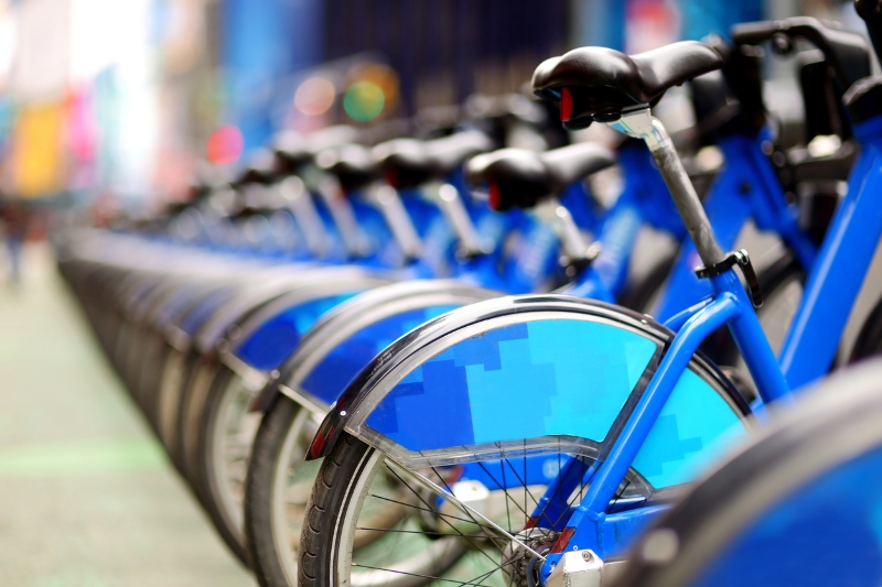 Row of city bikes for rent at docking stations in New York, USA